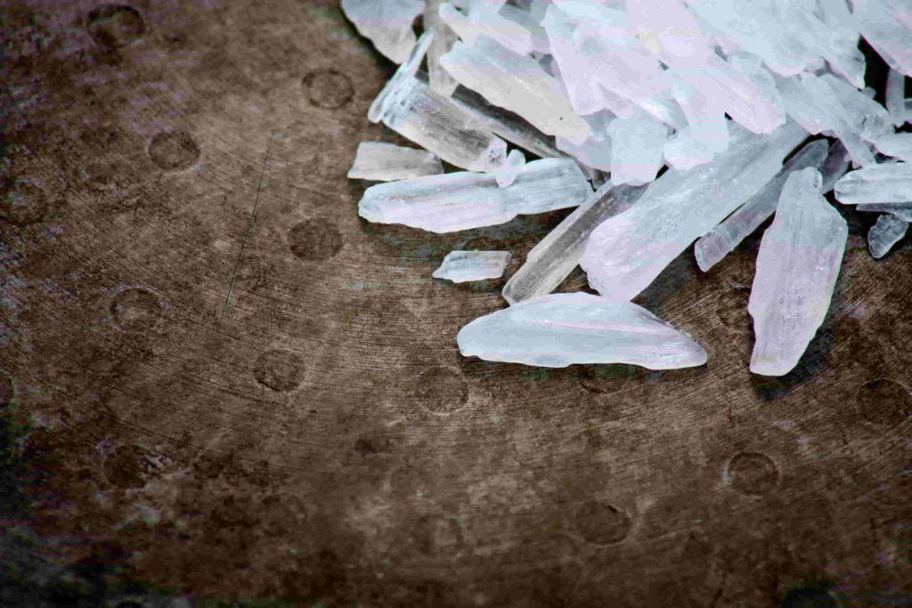 Crystal-like shards illustrating methamphetamine possession
