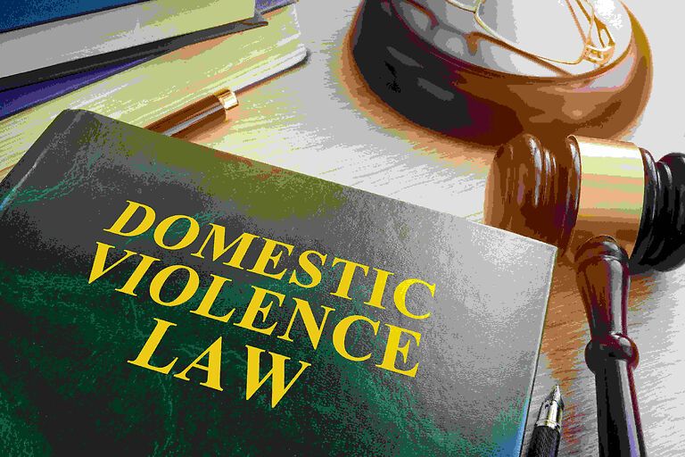 Domestic violence law book beside a gavel