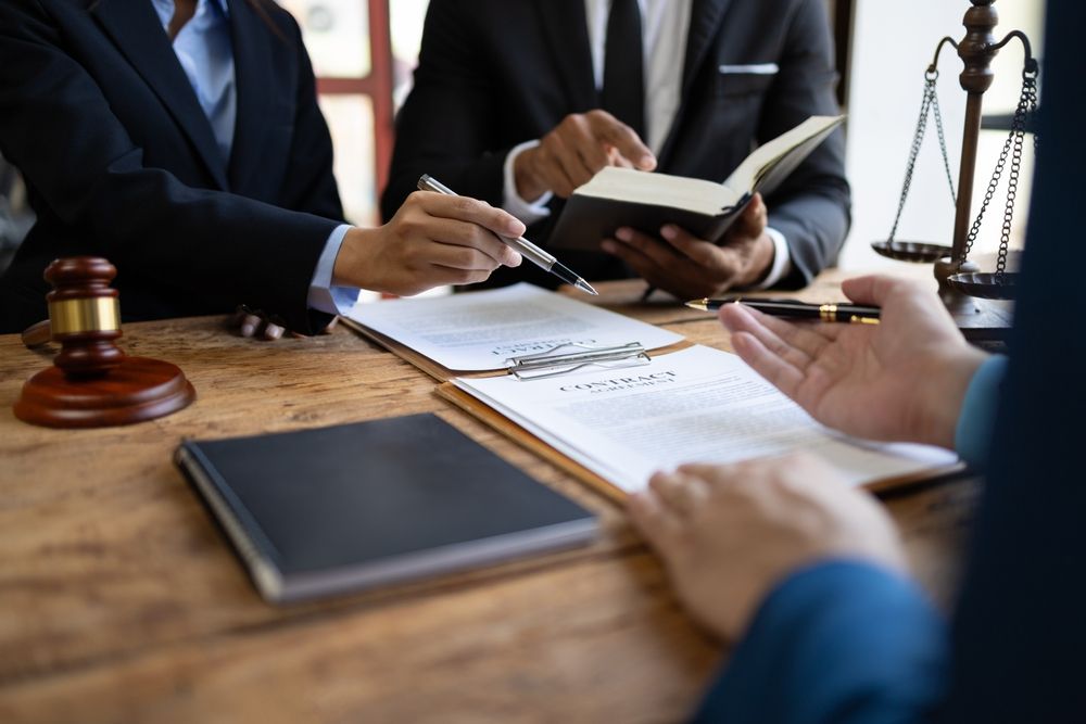 Attorney taking notes from an open law book