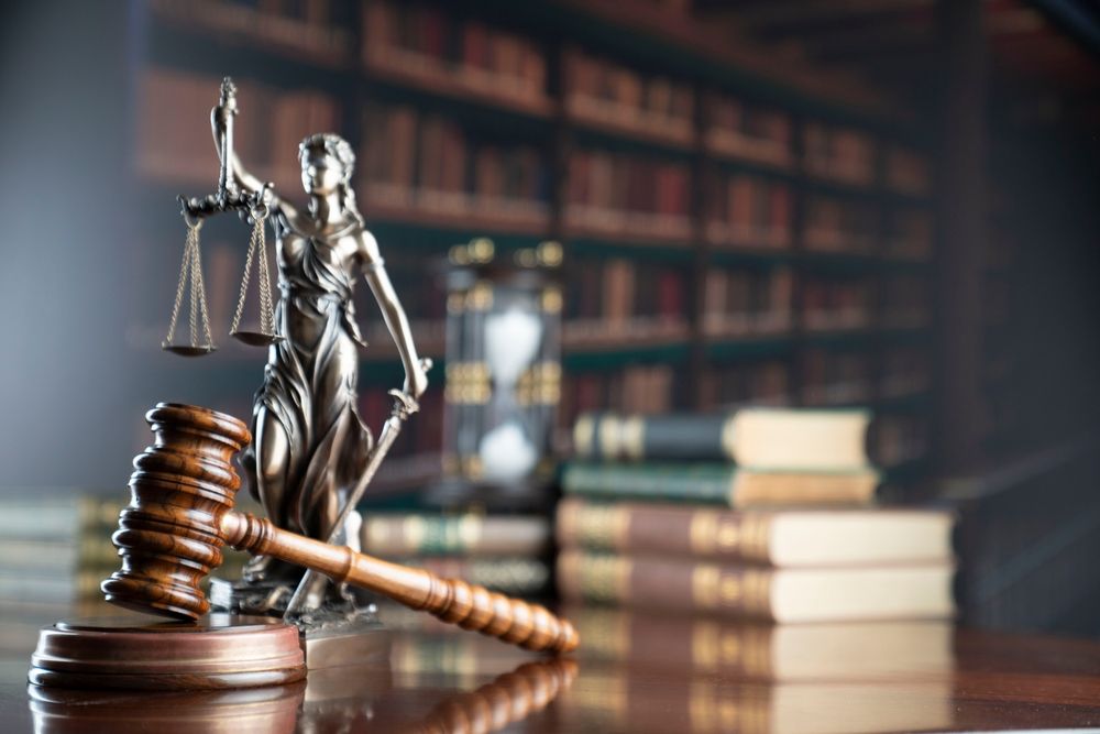 Lady Justice statue in a law library